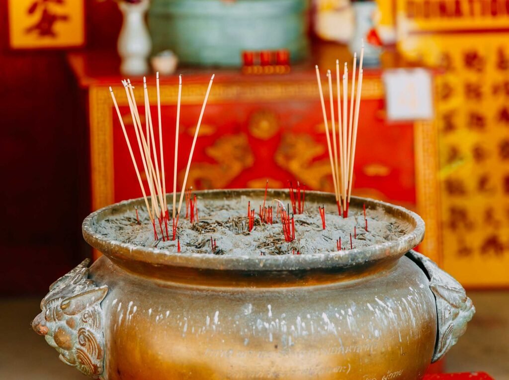smoke-from-incense-sticks-in-a-traditional-buddhis-2023-11-27-05-17-16-utc.jpg